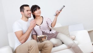 Young couple watching TV